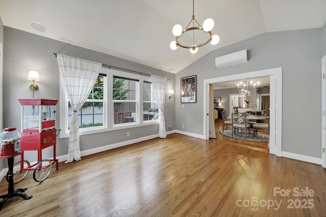 3426 Richards Xing, Fort Mill, SC 29708 - dining room with a chandelier, a wall unit AC, vaulted ceiling, wood finished floors, and baseboards