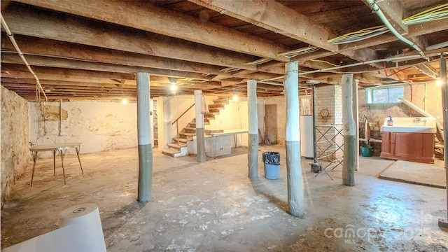 below grade area featuring gas water heater and stairs