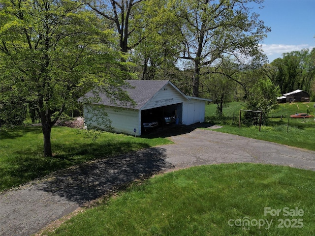 exterior space featuring aphalt driveway