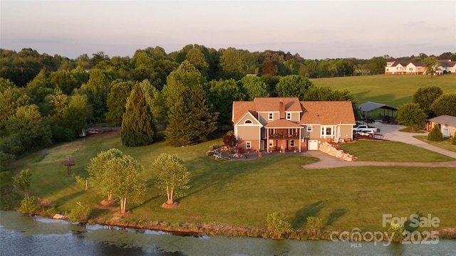 view of subject property with a nearby body of water