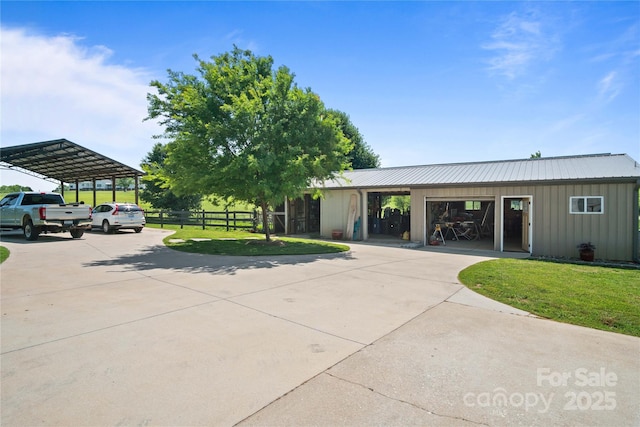 surrounding community featuring curved driveway and a carport