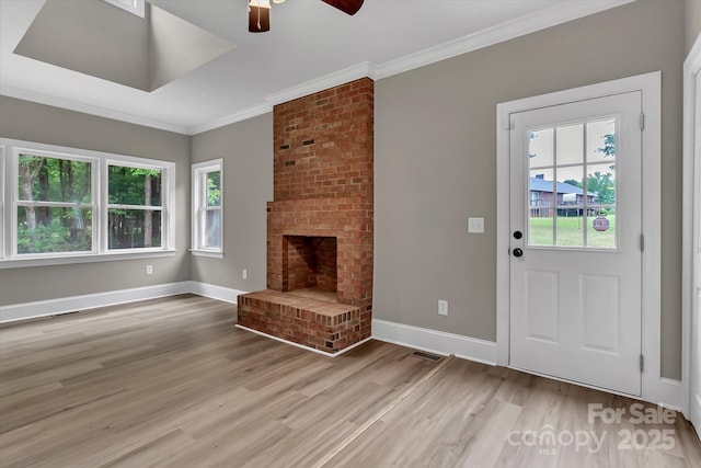 332 E Rebound Rd, Lancaster, SC 29720 - unfurnished living room with ceiling fan, plenty of natural light, light wood finished floors, crown molding, and baseboards