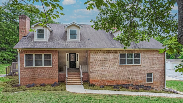 332 E Rebound Rd, Lancaster, SC 29720 - cape cod home with a chimney, brick siding, and a front yard