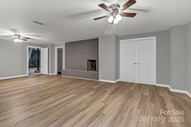 332 E Rebound Rd, Lancaster, SC 29720 - unfurnished living room featuring ceiling fan, baseboards, light wood finished floors, and a fireplace