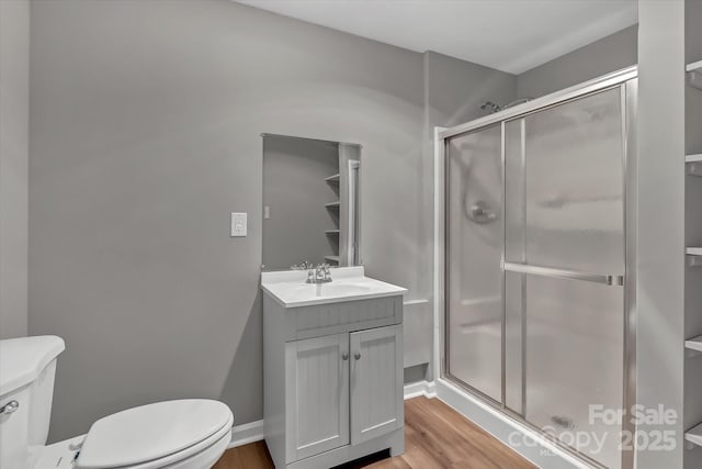 332 E Rebound Rd, Lancaster, SC 29720 - bathroom with toilet, a stall shower, wood finished floors, and vanity
