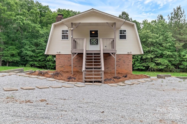 332 E Rebound Rd, Lancaster, SC 29720 - view of front of house featuring a chimney, stairway, brick siding, and a gambrel roof