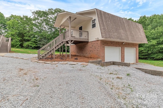 332 E Rebound Rd, Lancaster, SC 29720 - view of side of property featuring stairs, brick siding, a shingled roof, and a wooden deck