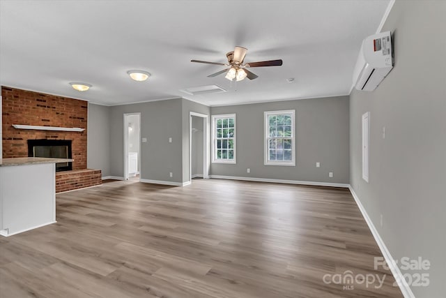 332 E Rebound Rd, Lancaster, SC 29720 - unfurnished living room featuring a wall mounted AC, baseboards, wood finished floors, and ornamental molding