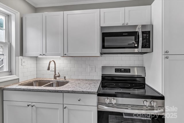 332 E Rebound Rd, Lancaster, SC 29720 - kitchen featuring stainless steel appliances, a sink, decorative backsplash, and white cabinets