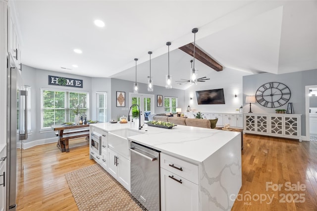 184 Quiet Cove Rd, Mooresville, NC 28117 - kitchen with stainless steel appliances, a sink, recessed lighting, white cabinetry, and plenty of natural light