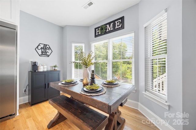 184 Quiet Cove Rd, Mooresville, NC 28117 - dining room with light wood-style flooring and baseboards