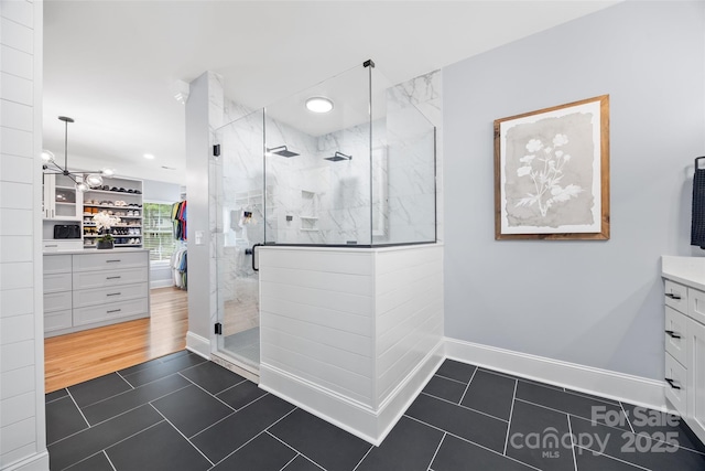 184 Quiet Cove Rd, Mooresville, NC 28117 - bathroom featuring tile patterned flooring, a shower stall, a chandelier, vanity, and recessed lighting