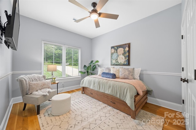 184 Quiet Cove Rd, Mooresville, NC 28117 - bedroom featuring baseboards, wood finished floors, and a ceiling fan