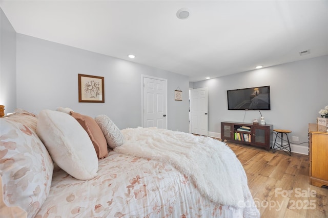 184 Quiet Cove Rd, Mooresville, NC 28117 - bedroom with light wood-style floors, recessed lighting, and baseboards