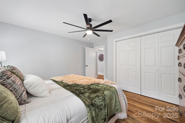 184 Quiet Cove Rd, Mooresville, NC 28117 - bedroom with wood finished floors, a closet, and ceiling fan