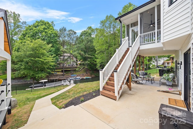 184 Quiet Cove Rd, Mooresville, NC 28117 - view of patio / terrace featuring a ceiling fan, stairway, a sunroom, and view of wooded area