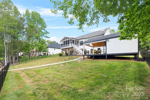 184 Quiet Cove Rd, Mooresville, NC 28117 - rear view of property with a sunroom, roof with shingles, stairway, and a deck