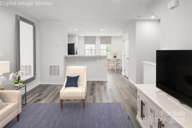 1430 Samuel St, Charlotte, NC 28206 - living room featuring light wood-style flooring, recessed lighting, and baseboards