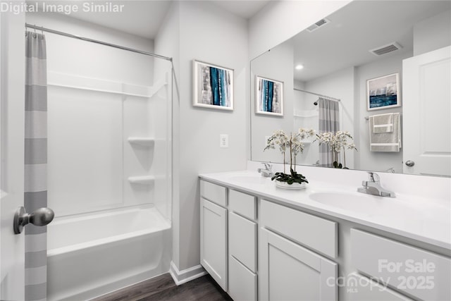 1430 Samuel St, Charlotte, NC 28206 - bathroom with double vanity, shower / tub combo, wood finished floors, and baseboards