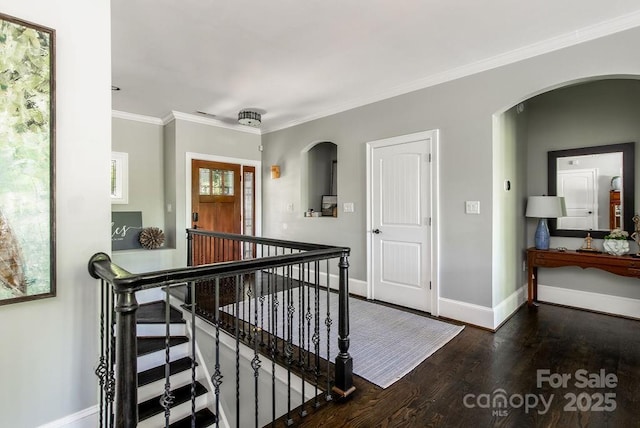 46827 Tall Whit Rd, New London, NC 28127 - hallway with wood finished floors, ornamental molding, an upstairs landing, arched walkways, and baseboards