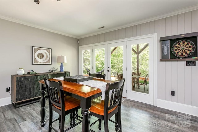 46827 Tall Whit Rd, New London, NC 28127 - dining room featuring crown molding, french doors, visible vents, and wood finished floors