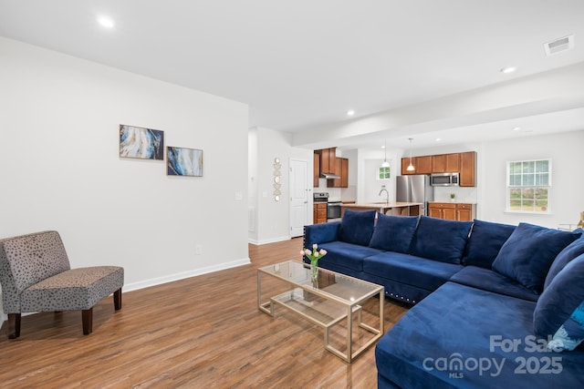 2012 Slippery Rock Ln, Monroe, NC 28112 - living area featuring wood finished floors, recessed lighting, and baseboards