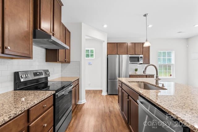 2012 Slippery Rock Ln, Monroe, NC 28112 - kitchen with stainless steel appliances, a sink, under cabinet range hood, healthy amount of natural light, and recessed lighting