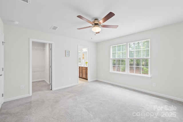 2012 Slippery Rock Ln, Monroe, NC 28112 - unfurnished bedroom with a spacious closet, light colored carpet, baseboards, and a closet