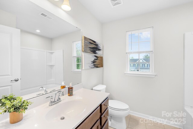 2012 Slippery Rock Ln, Monroe, NC 28112 - full bathroom with plenty of natural light, vanity, toilet, and tile patterned floors