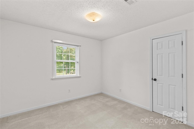 115 Three Oaks Ln, Statesville, NC 28677 - unfurnished room with light colored carpet, a textured ceiling, and baseboards