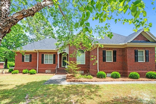 600 Robinhood Dr, Cheraw, SC 29520 - view of front of home featuring a front yard, brick siding, and a shingled roof