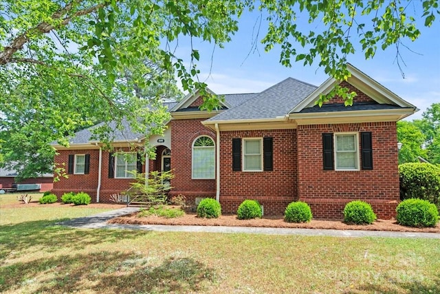 600 Robinhood Dr, Cheraw, SC 29520 - ranch-style house with brick siding, roof with shingles, and a front yard