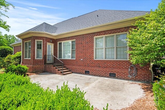 600 Robinhood Dr, Cheraw, SC 29520 - rear view of house featuring a patio area, crawl space, brick siding, and roof with shingles
