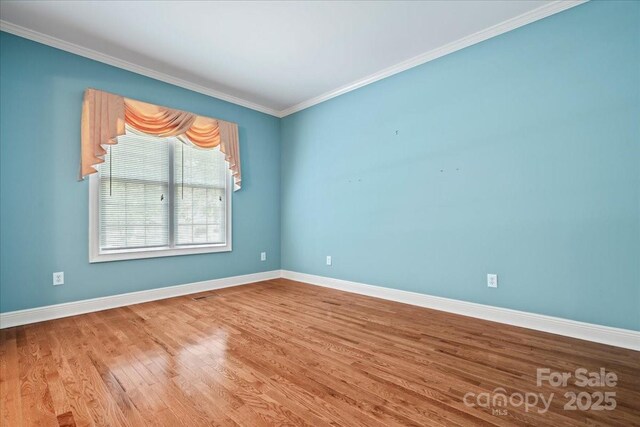 600 Robinhood Dr, Cheraw, SC 29520 - empty room with wood finished floors, baseboards, and ornamental molding