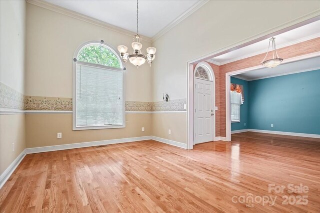 600 Robinhood Dr, Cheraw, SC 29520 - unfurnished dining area featuring a chandelier, ornamental molding, baseboards, and wood finished floors