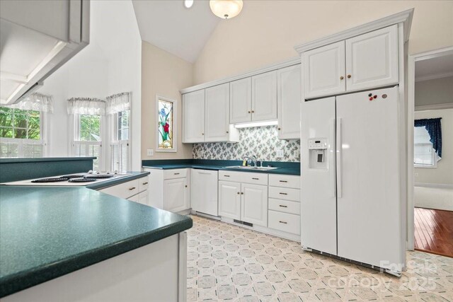 600 Robinhood Dr, Cheraw, SC 29520 - kitchen with white cabinetry, white appliances, dark countertops, and a sink
