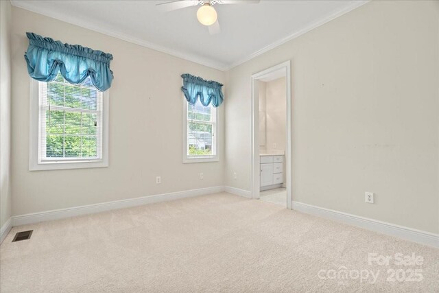 600 Robinhood Dr, Cheraw, SC 29520 - empty room featuring baseboards, ceiling fan, visible vents, crown molding, and light colored carpet