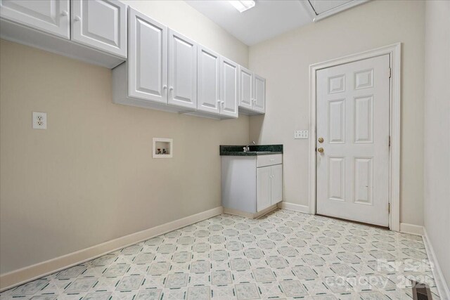 600 Robinhood Dr, Cheraw, SC 29520 - laundry room with a sink, cabinet space, hookup for a washing machine, light floors, and baseboards