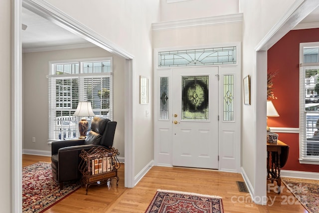 216 Cold Stream Way, Hendersonville, NC 28791 - entrance foyer featuring crown molding, light wood-style floors, and baseboards
