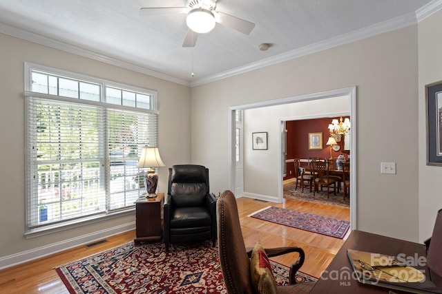 216 Cold Stream Way, Hendersonville, NC 28791 - living room with baseboards, ornamental molding, light wood finished floors, visible vents, and ceiling fan with notable chandelier