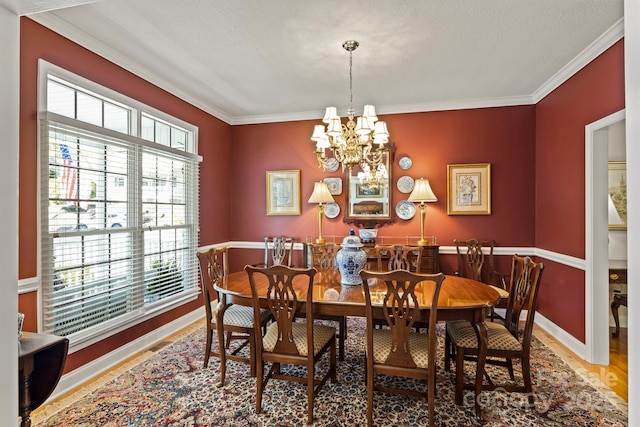 216 Cold Stream Way, Hendersonville, NC 28791 - dining room featuring baseboards, a wealth of natural light, a chandelier, and crown molding