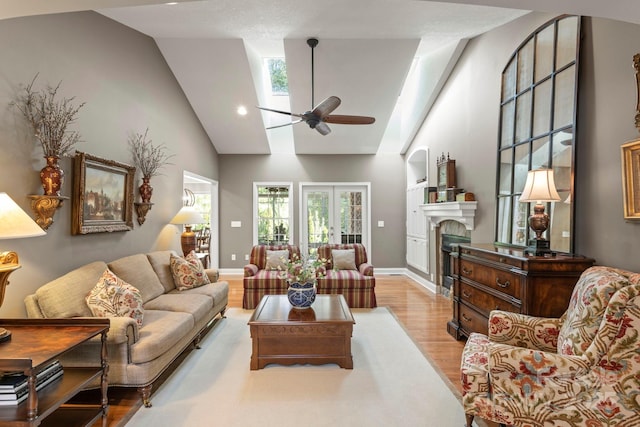 216 Cold Stream Way, Hendersonville, NC 28791 - living area with a fireplace, high vaulted ceiling, a ceiling fan, and wood finished floors