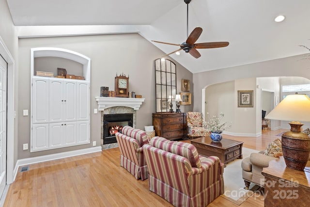 216 Cold Stream Way, Hendersonville, NC 28791 - living area with a lit fireplace, light wood-type flooring, ceiling fan, vaulted ceiling, and recessed lighting