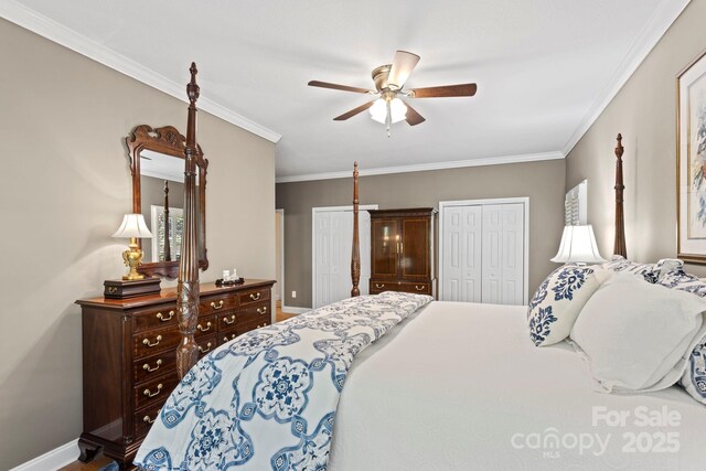 216 Cold Stream Way, Hendersonville, NC 28791 - bedroom featuring ceiling fan, ornamental molding, baseboards, and multiple closets
