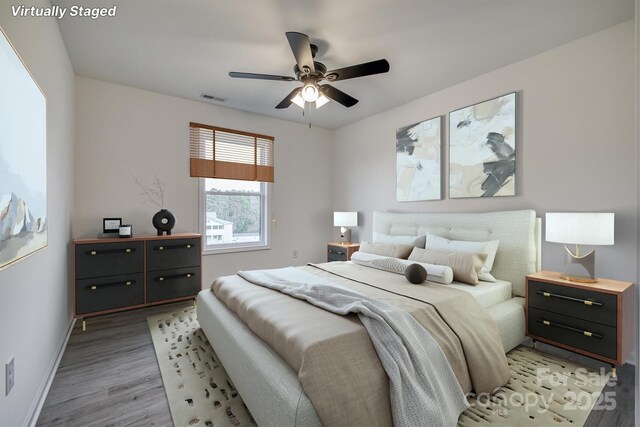 1265 Margaret St NW, Valdese, NC 28690 - bedroom featuring light wood-type flooring, ceiling fan, baseboards, and visible vents