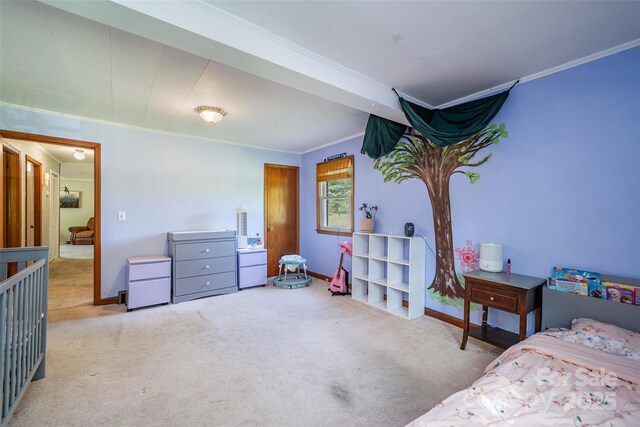 bedroom with carpet flooring, ornamental molding, and baseboards