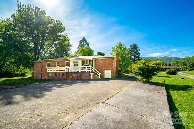 view of outbuilding with stairway and a mountain view