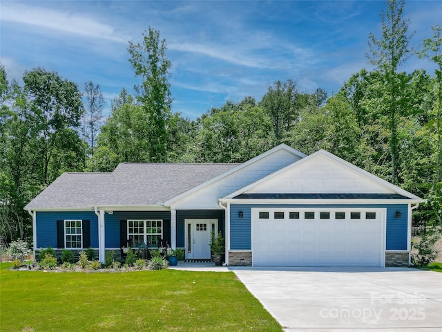 view of front of property with a garage, a front yard, driveway, and covered porch