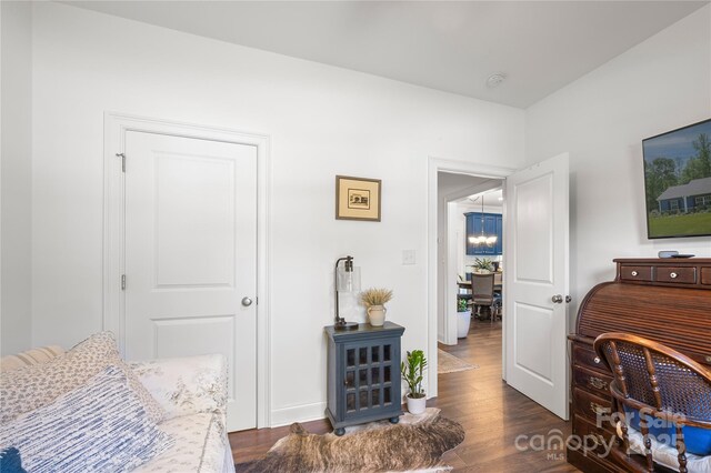 bedroom with dark wood finished floors