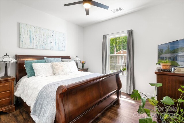 bedroom with wood finished floors and a ceiling fan